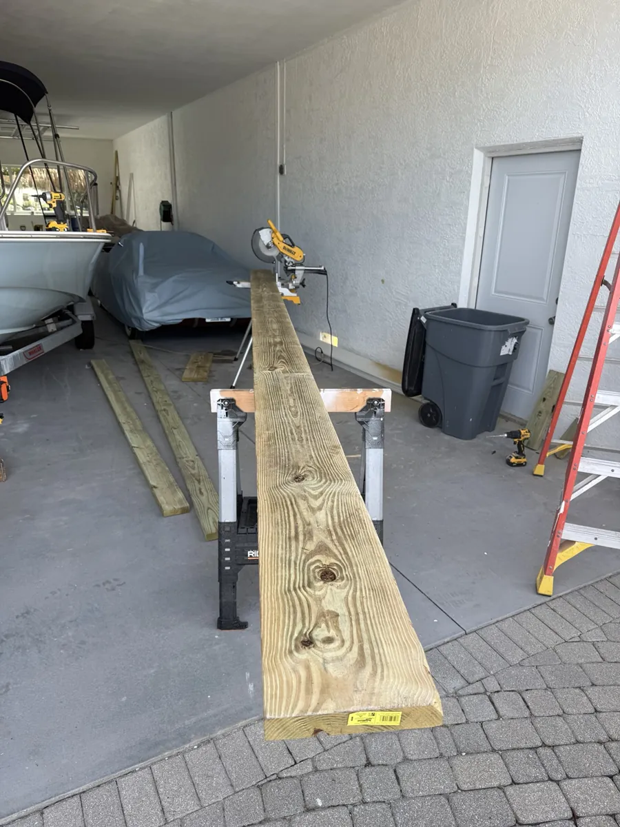Lumber and tools set up inside the garage