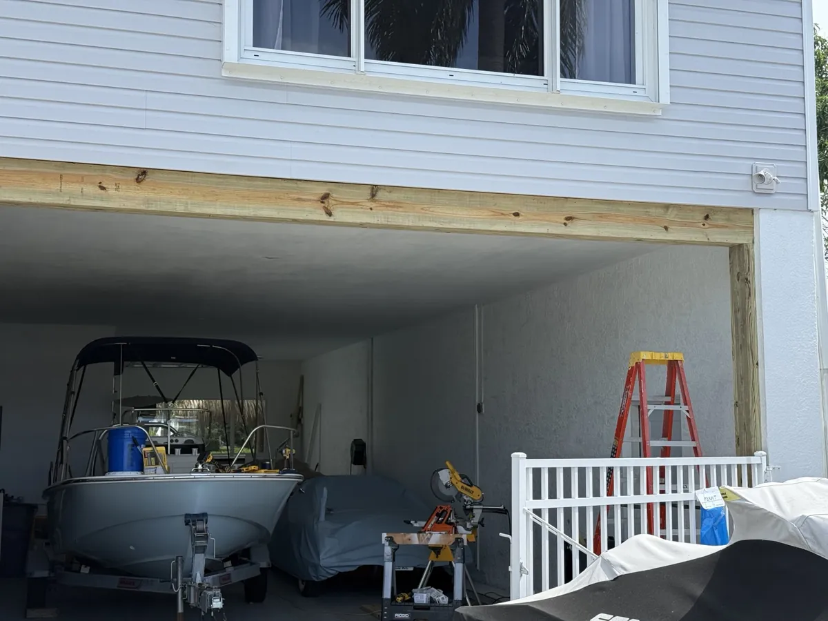 Full garage opening during fill-in work before the finished trim