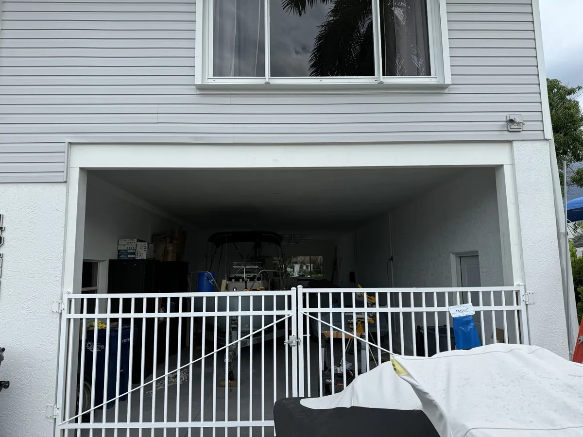 Garage opening with finished white trim, ready for the new door
