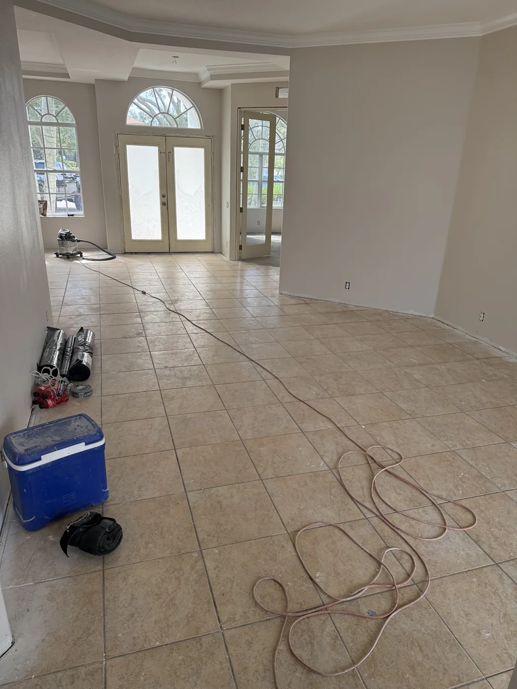 Existing tile floor and refinished walls during interior preparation