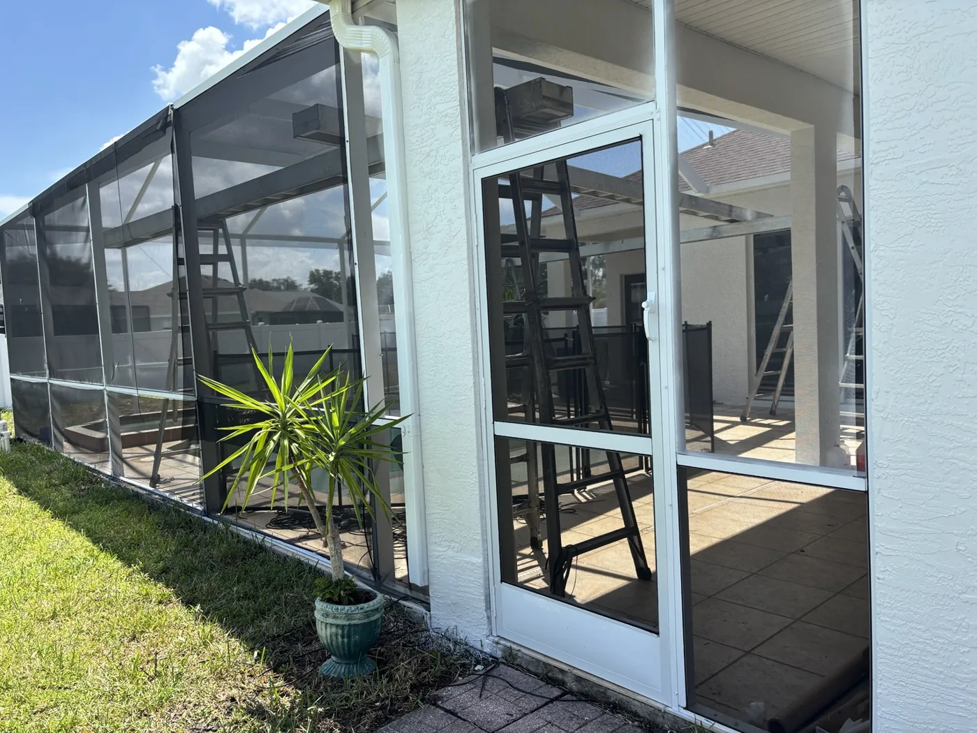 Renewed white enclosure door and new screening with equipment still on site